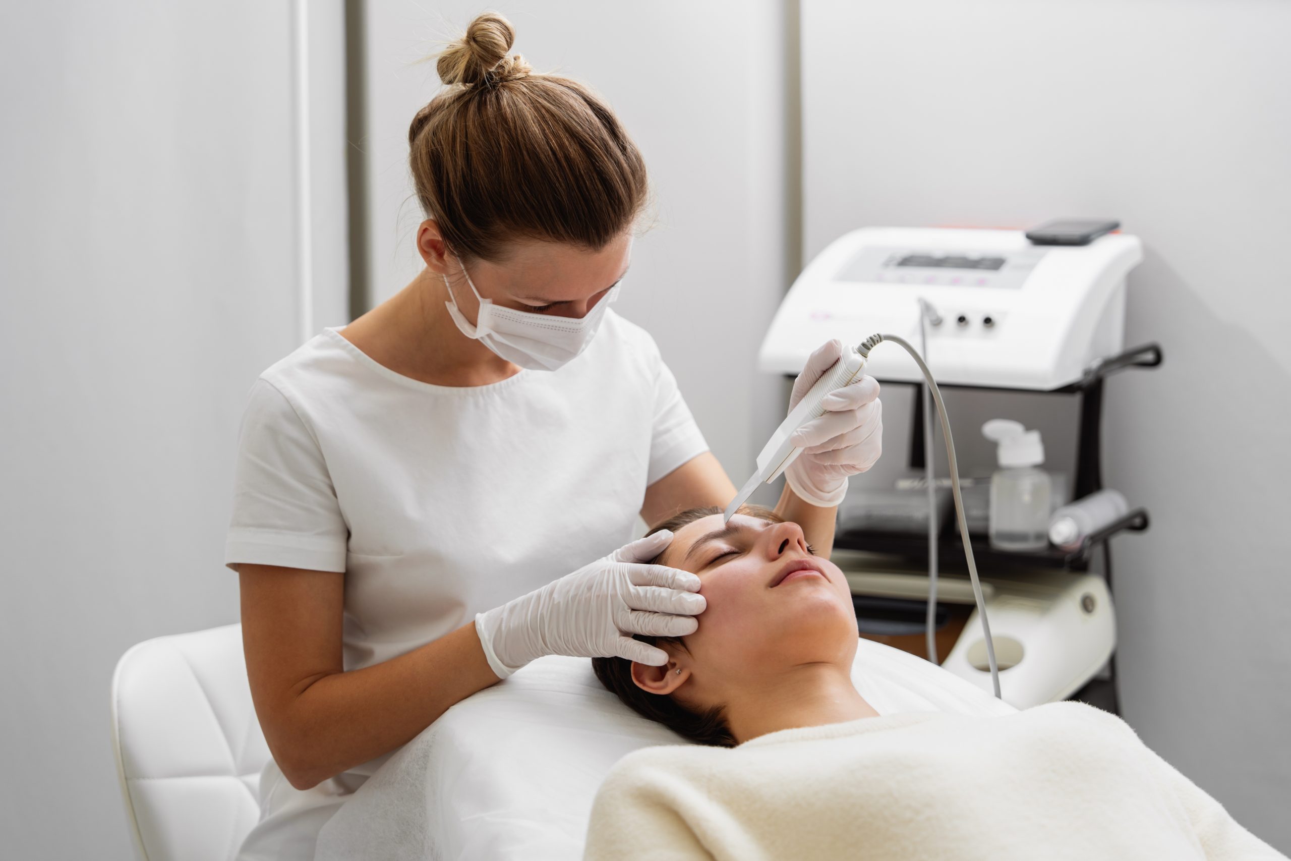 Client paying for studio session using mobile payment app.